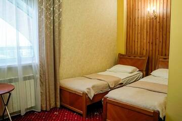 Фото номера Первая категория Стандарт 2-местный с двумя односпальными кроватями Гостиница Легенда Байкала г. Листвянка 11